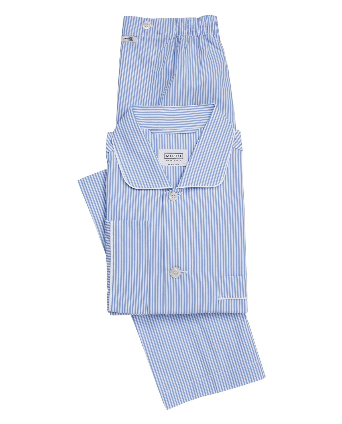 A man stands barefoot facing away from the camera in a MIRTO 1956 - BLUE STRIPE COTTON POPLIN PAJAMA SET, featuring long sleeves and pants—a timeless men’s sleepwear piece by MIRTO 1956, shown against a plain light background.