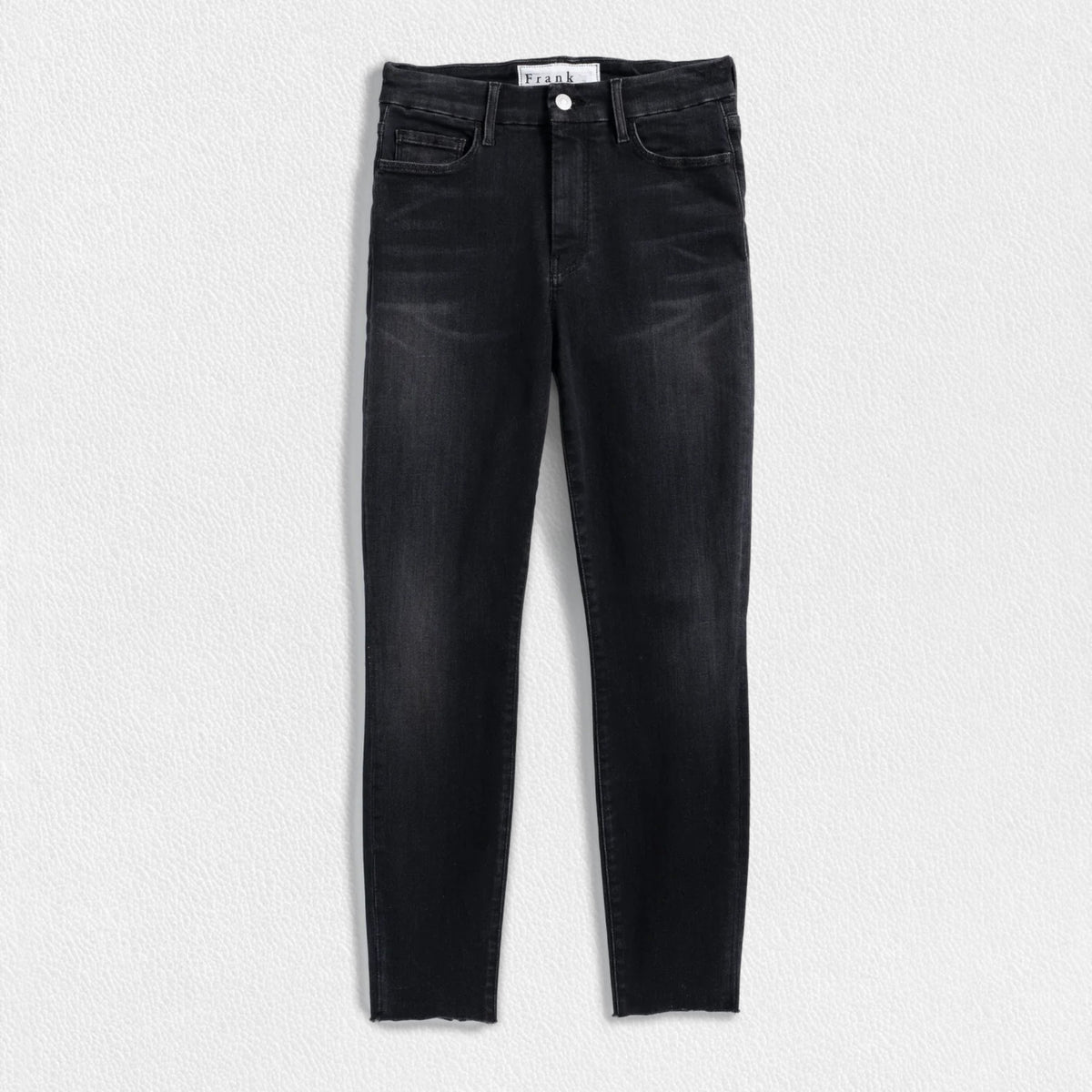 A pair of the FRANK &amp; EILEEN Sligo Skinny Jeans in the 1991 Wash is laid flat against a plain white background. These jeans feature a high-rise contour waistband, five pockets, and a slightly faded design on the thighs, offering a stylish and modern look with Italian Performance Denim for added comfort.
