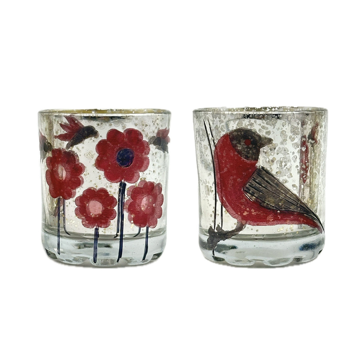 The CREATIVE COOP VOTIVE HOLDER WITH BIRDS OR FLOWERS includes two clear glass holders—one with hand-painted red flowers and blue stems, the other with a red and brown bird—both featuring a speckled, rustic texture.