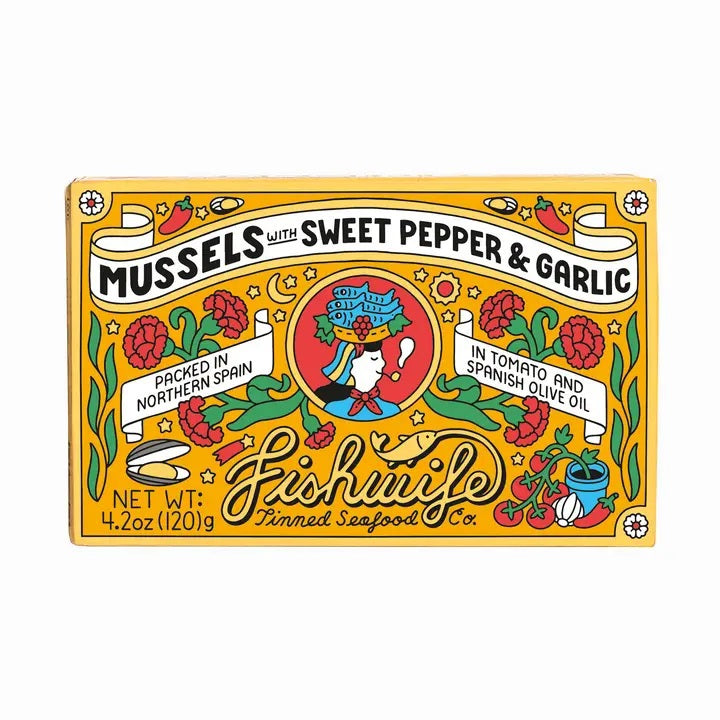 A vibrant box of FISHWIFE Mussels with Sweet Pepper & Garlic showcases decorative illustrations, stylish text, and a central figure holding a fish, emphasizing these artisanal canned mussels as premium seafood packed in Spain.
