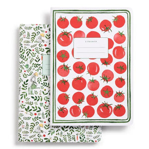 The E. FRANCES PAPER STITCHED NOTEBOOKS GARDENER, SET OF 2, featuring a green and white checkered cover, is open on a white surface next to two striped pencils—one green and one pink—with the right page blank.