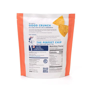 A bag of ANCIENT CRUNCH - TRADITIONAL TORTILLA CHIPS by ANCIENT CRUNCH with red and white stripes stands upright, labeled "Original" and "No Seed Oils," highlighting its seed oil-free recipe with crunchy chips scattered in front.