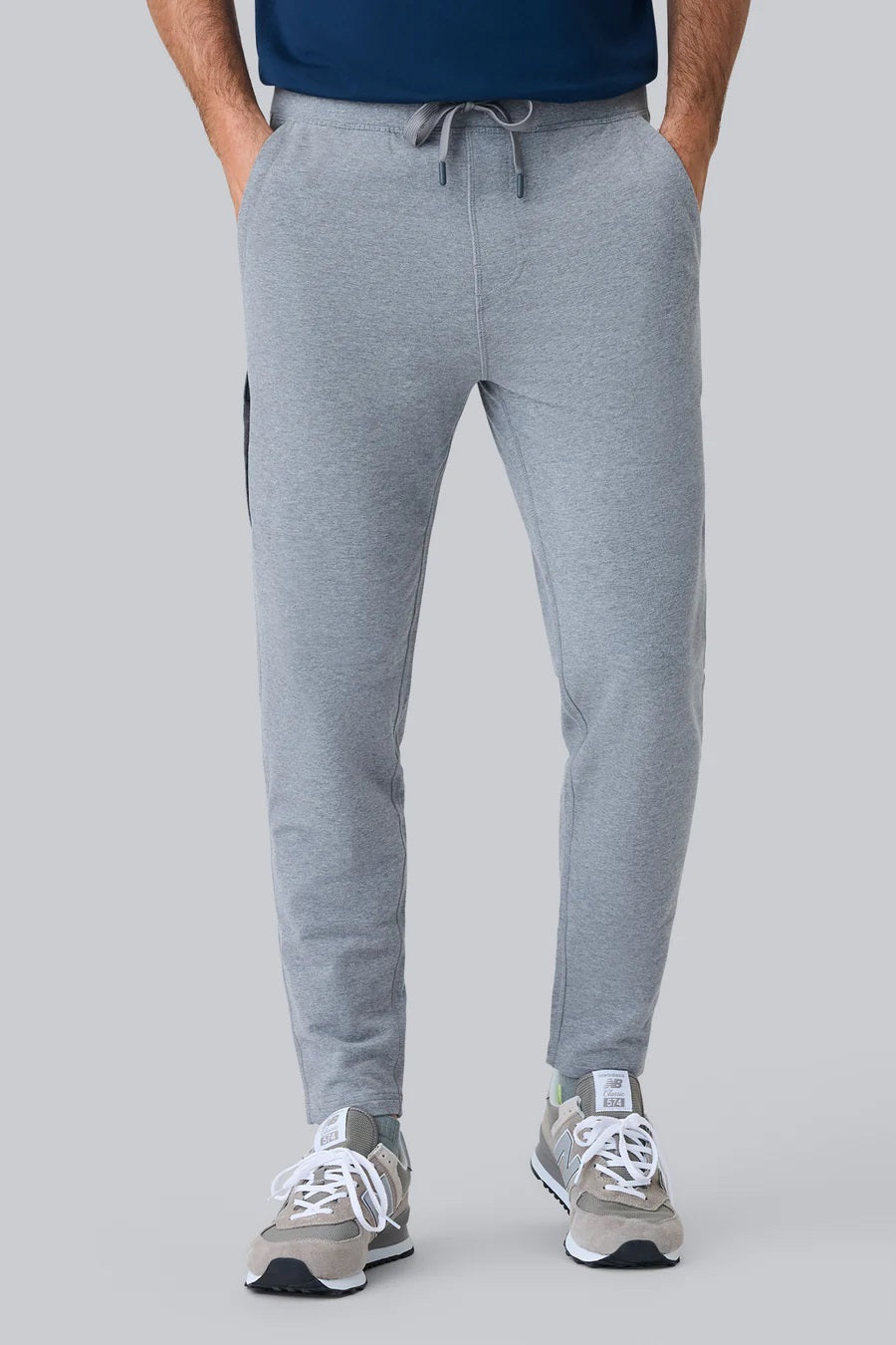 MACK WELDON Ace Sweatpants in Burnt Sage feature an elastic waistband, adjustable drawstring, zippered side pocket, and tapered legs for a tailored fit; shown flat on a plain background.