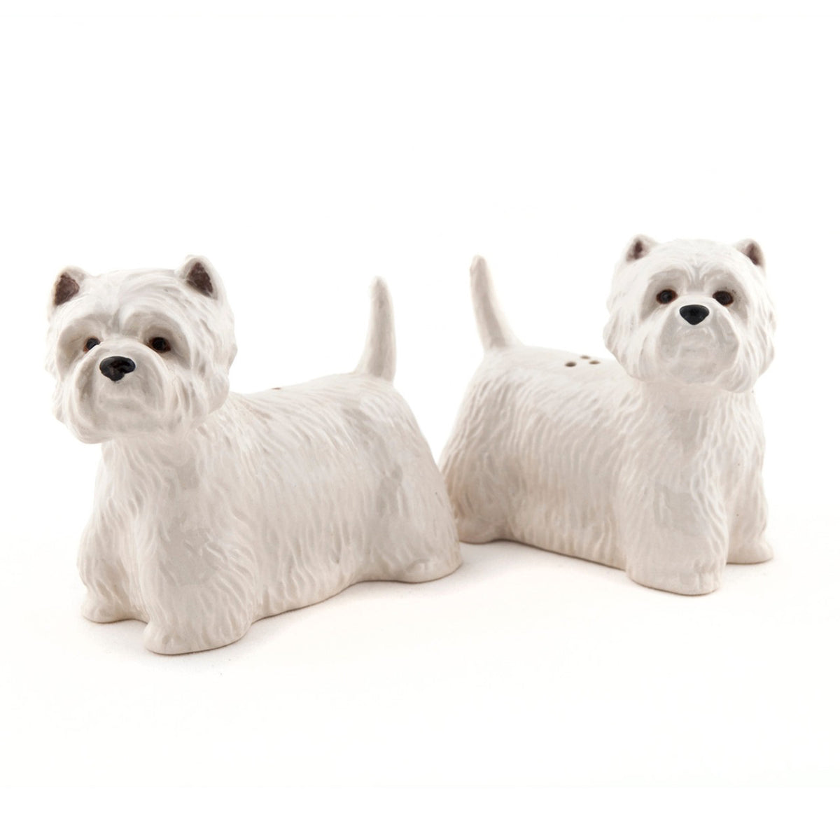 The QUAIL CERAMICS - WESTIE SALT AND PEPPER SET by QUAIL DESIGNS features handpainted stoneware shakers shaped like white West Highland Terriers. Charming and dishwasher safe, they’re displayed side by side on a white background.