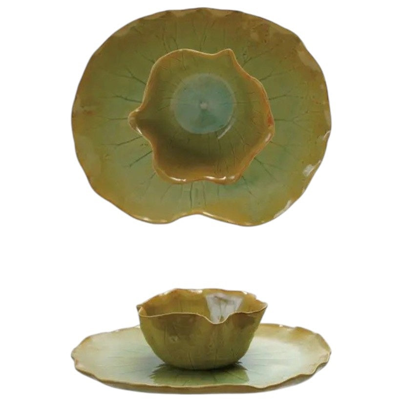 The CREATIVE COOP STONEWARE WATER LILY PLATE WITH BOWL features a green lotus leaf shape and reactive crackle glaze, displayed together against a plain gray background.