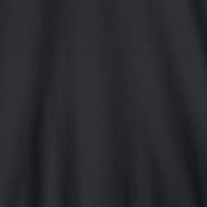A person stands facing forward, wearing the SAVE THE DUCK - TULIO JACKET IN BLUE BLACK by SAVE THE DUCK, paired with gray pants and white sneakers, against a plain light background.