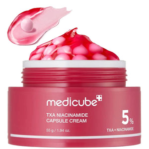 An open jar of GLOWISS MEDICUBE - TXA NIACINAMIDE CAPSULE CREAM shows pink capsules. Text highlights: reduces uneven skin tone, boosts clarity and glow with tranexamic acid. #PopandGlow #ImproveSkinClarity #RadiantGlassSkin.