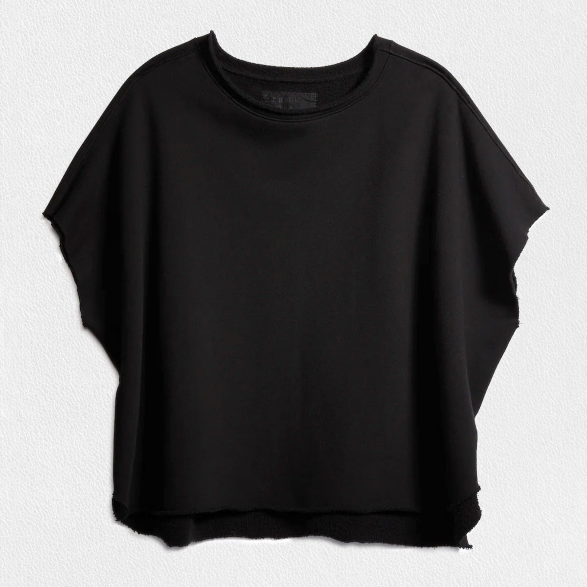 The FRANK &amp; EILEEN OLIVE ORIGINAL CAPELET in black, by FRANK &amp; EILEEN, is a black oversized T-shirt with a round neckline and short, wide sleeves. Made from 100% cotton, it features a loose fit and simple design reminiscent of a capelet against a light textured background.
