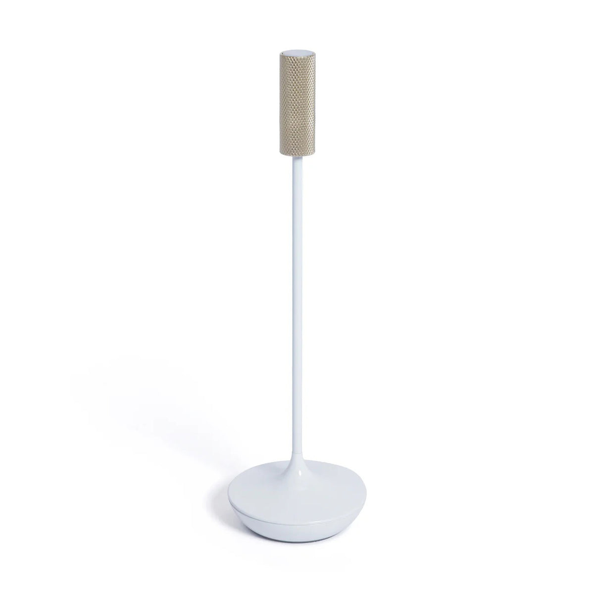 The ZODAX SLEEK RECHARGEABLE TABLE LIGHT, a modern, slim white lamp with adjustable brightness, stands on a festive table with glassware, champagne, chocolates, and gold decor, adding a cozy, celebratory vibe.