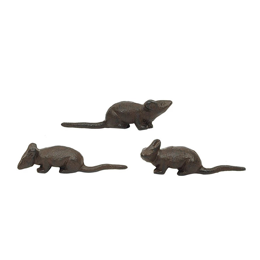 Positioned against a plain white background are three small, dark brown &quot;CAST IRON MOUSE&quot; figurines by CREATIVE COOP. Each measuring 5 inches in length, these figurines feature varied poses and detailed features, conveying a rustic and playful aesthetic through their assorted styles.