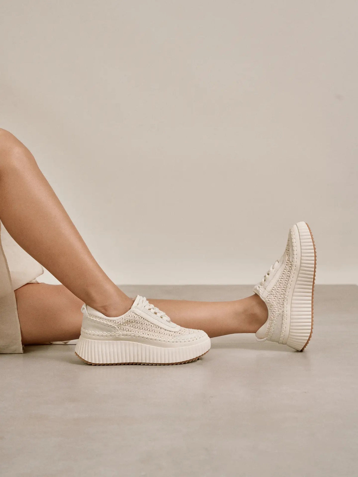 The MIRACLE MILES DOLEA SUEDE WOVEN KNIT SNEAKER features beige suede, a chunky platform sole, and lace-up front for casual elegance, shown in profile on a white background.