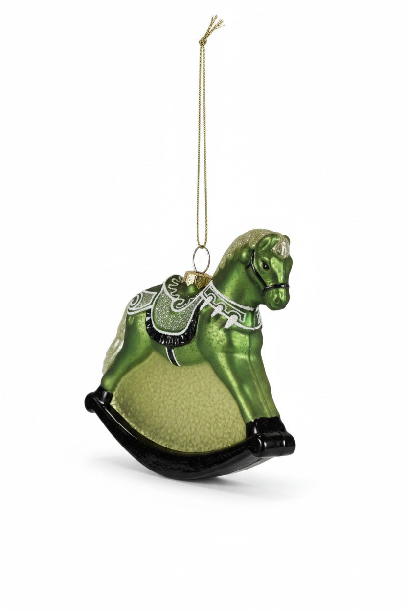 Creative Coop Rocking Horse Ornament With Glitter: a green glittery glass rocking horse Christmas ornament featuring a black rocker base and a decorative saddle.