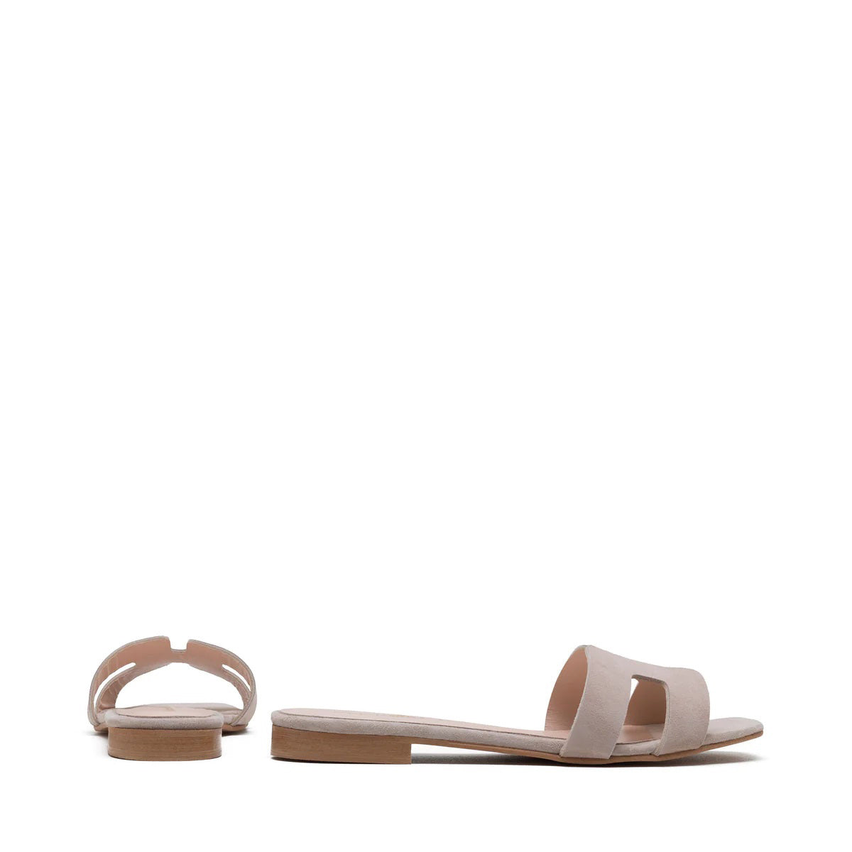 The image depicts the MICHELE LOPRIORE - H SLIDE, a single brown leather slide sandal with an open-toe design. The upper features two wide straps with geometric cutouts. The thin sole appears to be made of light brown wood-like material. Made in Italy by MICHELE LOPRIORE, the sandal is displayed against a plain white background.