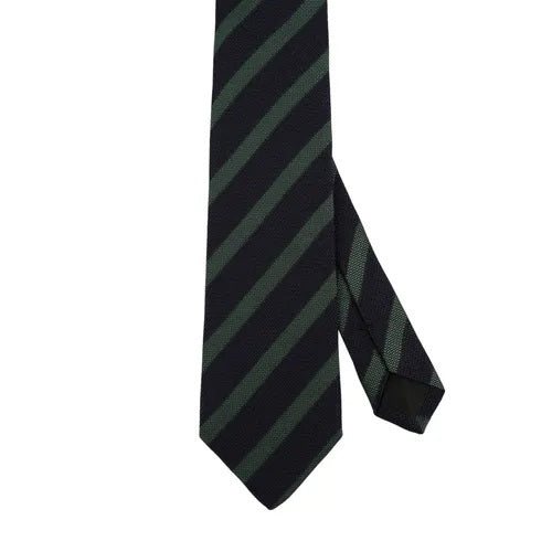 The AMANDA CHRISTENSEN Striped Jacquard Woven Silk Tie in Green showcases refined Italian craftsmanship with diagonal black and dark green stripes on a crisp white background, making it a sophisticated accessory that enhances any gentleman’s wardrobe.