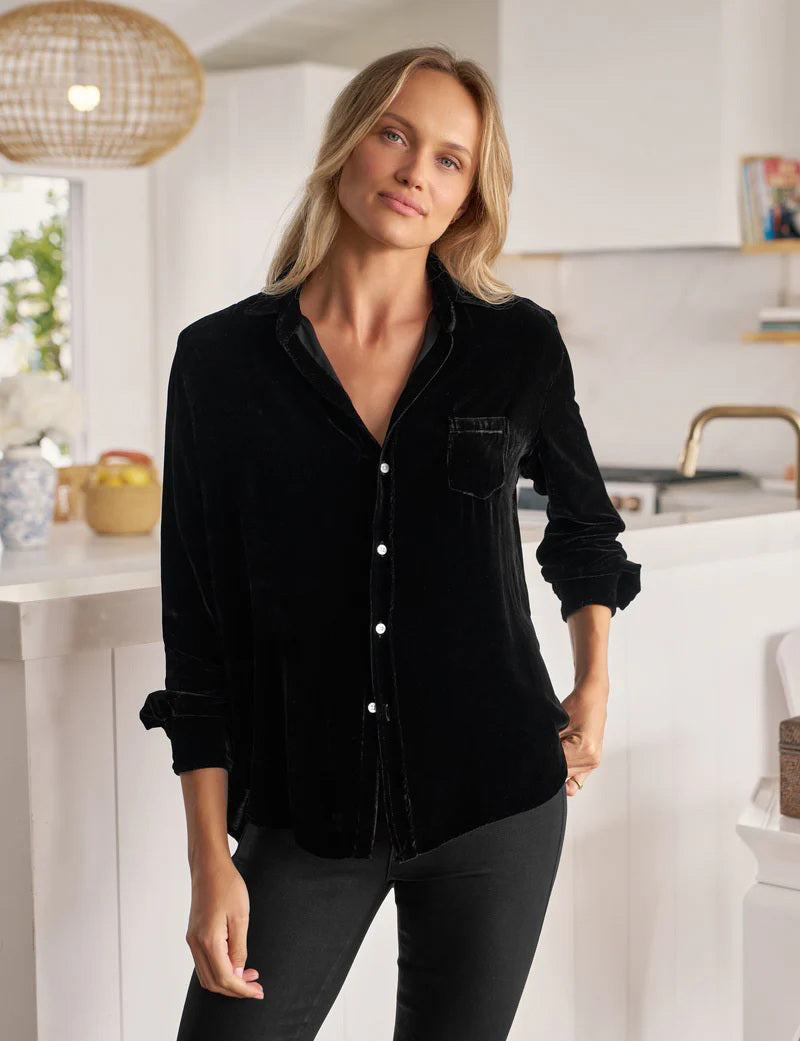 The FRANK &amp; EILEEN EILEEN Relaxed Button Up in Black Italian Washed Velvet features a collar, front pocket, bust-flattering buttons, and rolled-up sleeves. The label inside reads "Frank &amp; Eileen.
