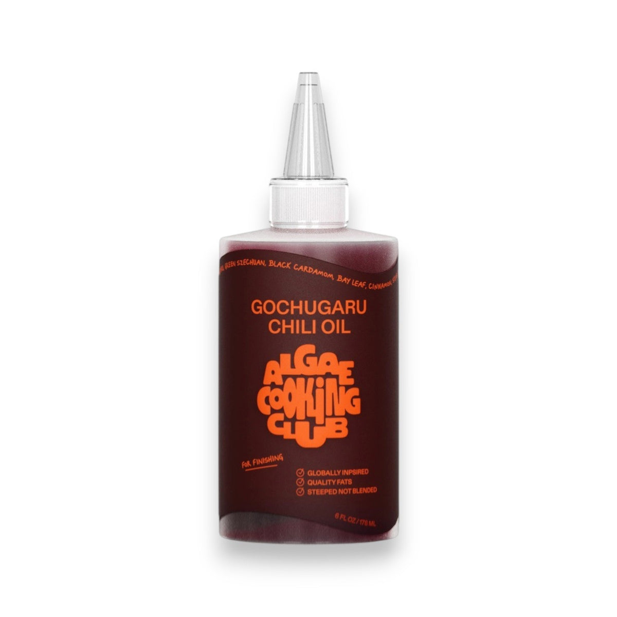 A clear plastic bottle labeled "ALGAE COOKING CLUB - GOCHUGARU CHILI OIL" in bold orange text sits on a white surface against a plain background, holding vibrant Korean chili oil from ALGAE COOKING CLUB.