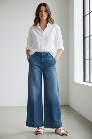 The FRANK & EILEEN West Village NYC Wide Leg Trouser in Italian Dream Light Denim 1986 Wash features front pleats and belt loops, shown flat against a white background for a chic New York City-inspired style.