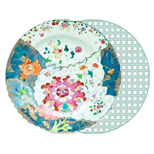 A watercolor illustration of a decorative floral plate paired with the HOLLY STUART DESIGNS - ROUND TOBACCO LEAF PLACEMAT, featuring a translucent lattice pattern inspired by chinoiserie style.