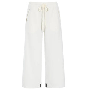 Here’s a rewritten version using your product data: A sizing guide chart for the HENRIETTE STEFFENSEN - FLEECE FLARED CROPPED TROUSER by HENRIETTE STEFFENSEN, featuring measurements for chest, waist, and hips in centimeters for sizes XS to XXL—including information specific to fleece pants and flared trousers—with separate charts for normal and loose fits, plus a diagram illustrating where to measure.