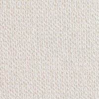 A woman with long braided hair is wearing the KINROSS CASHMERE - BUTTON VEST by KINROSS, a luxurious sleeveless navy blue button-up vest, paired with white pants. She is smiling and standing against a plain white background with one hand in her pocket.