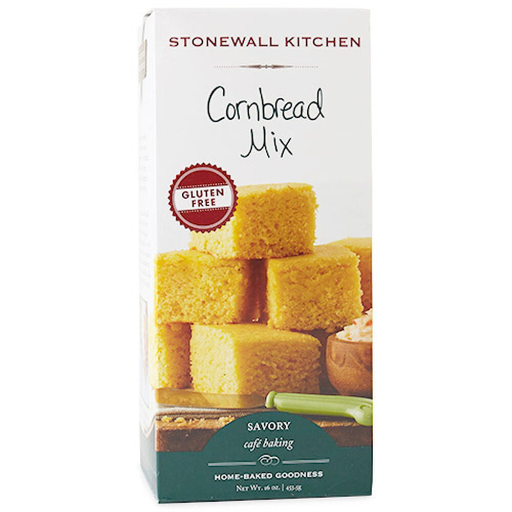 A box of STONEWALL KITCHEN - GLUTEN FREE CORNBREAD MIX is shown, highlighting its delectable cornmeal flavor and gluten-free quality. The front features an image of several cornbread squares. Text at the bottom notes that it is part of their Savory Café Baking line and weighs 16 oz.