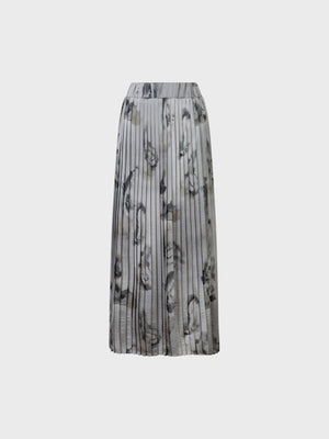 The SANDRO FERRONE Pleated Maxi Skirt in grey, by Sandro Ferrone, features a gray and black abstract pattern and is shown against a plain white background.