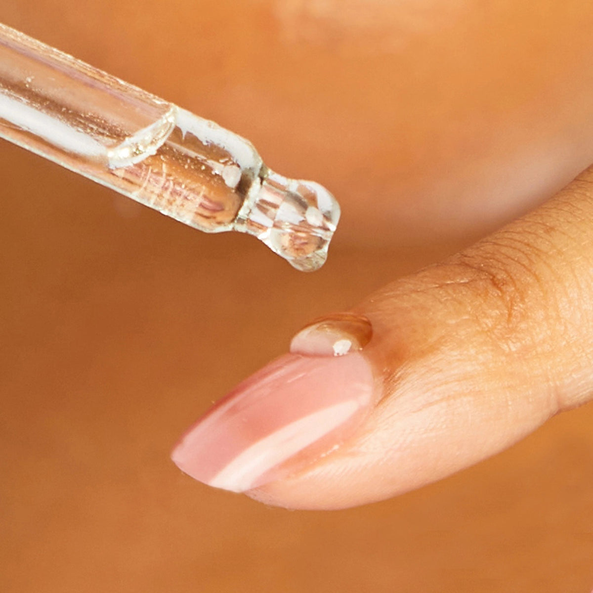 A brown glass bottle labeled "KITSCH - 100% CASTOR OIL" is set between a black mascara wand and a clear oil dropper. Renowned for supporting hair growth and moisturizing cuticles, this beauty essential is displayed on a plain white background.