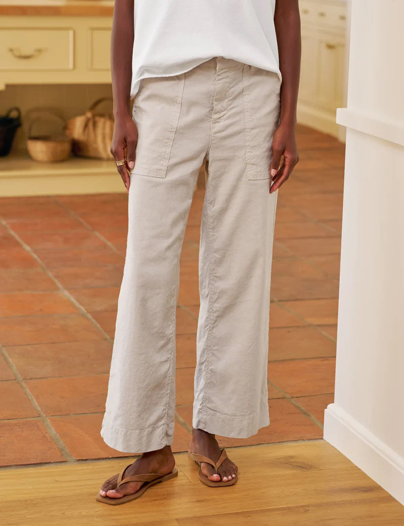 The FRANK &amp; EILEEN Wexford Patch Pocket Wide Leg Pant in Cement is a light beige Italian Performance Linen trouser with front patch pockets, belt loops, and a high waist, shown laid flat on a white background.