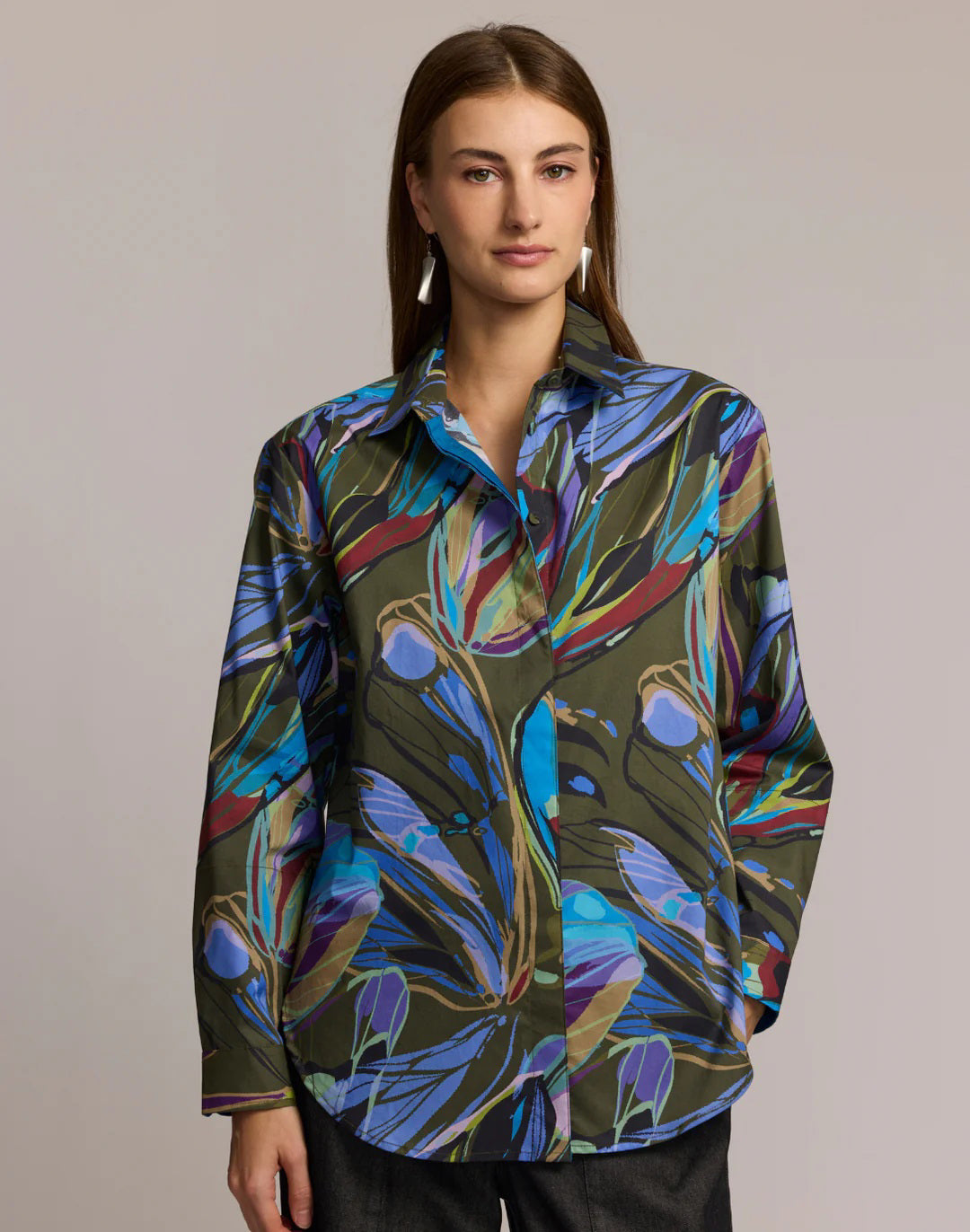 A woman with long brown hair wears the HINSON WU Halsey Long Sleeve Shirt in Abstract Print, made from a premium cotton blend, posing against a plain background with a neutral expression.