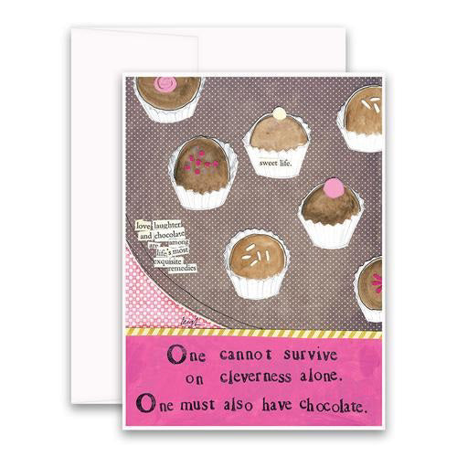 Introducing the CURLY GIRL DESIGNS - CLEVERNESS ALONE GREETING CARD by Curly Girl Design, Inc. This charming card features delightful illustrations of assorted chocolates adorned with decorative toppings. The dotted background is artfully inscribed with phrases such as "love, laughter, and chocolate" and "sweet life." At the bottom of the card, a whimsical quote reads: "One cannot survive on cleverness alone; one must also have chocolate, the sweetest of remedies.