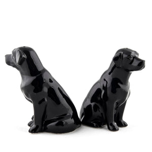 The QUAIL CERAMICS - BLACK LABRADOR SALT AND PEPPER SET from QUAIL DESIGNS features two glossy black handpainted labrador stoneware figurines. Charming and dishwasher proof, they make a delightful addition to any table.