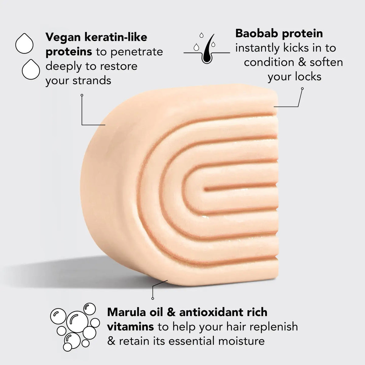 A KITSCH - STRENGTHENING BOND REPAIR SOLID HAIR MASK BAR rests by its brown box with bamboo stems, highlighting its vegan keratin formula for glass hair that's color safe and pH balanced.