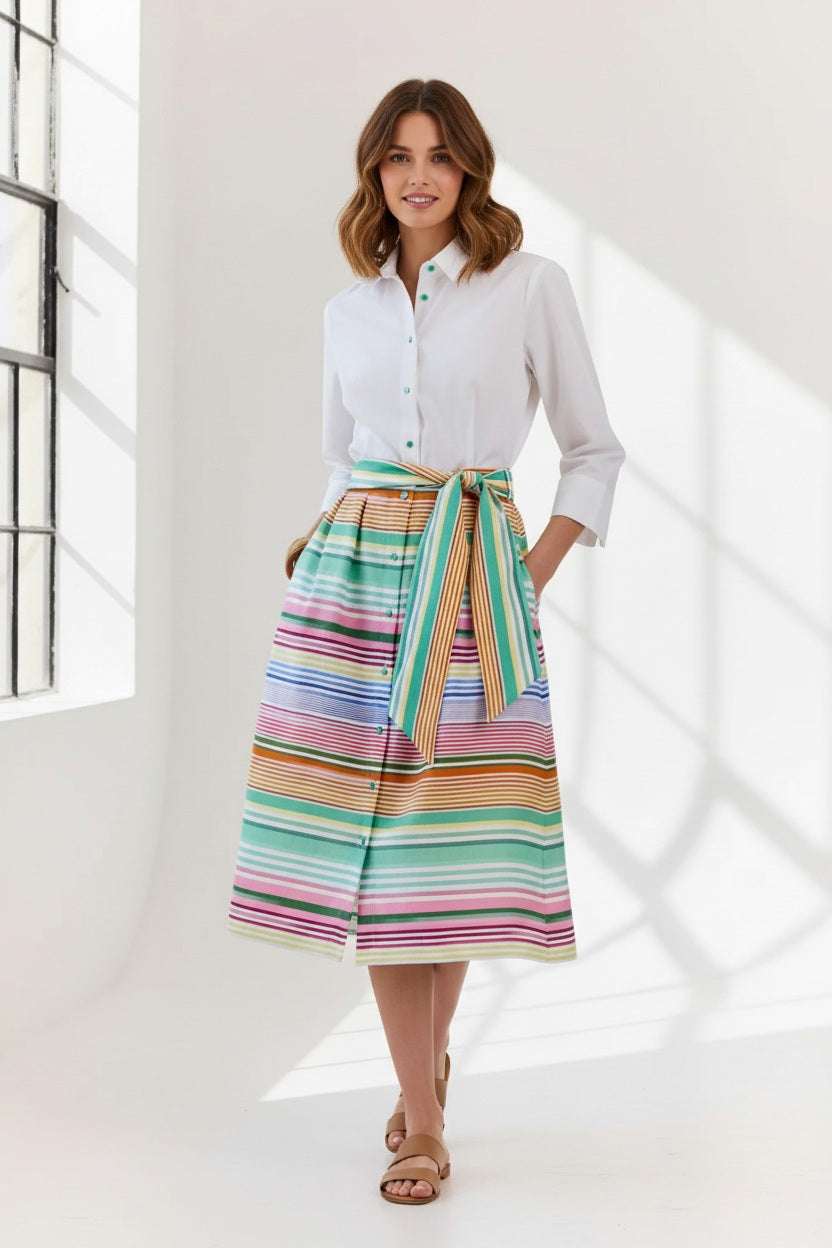 A woman wears the HINSON WU Robin 3/4 Sleeve Linen Dress in Multi Stripe, featuring breathable fabric and a matching tie belt, standing against a plain light background.