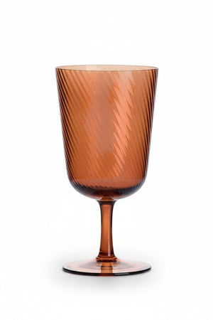 Amber-tinted OPTIC SWIRL ALL PURPOSE GLASS with a subtle diagonal swirl optic pattern and a delicate stem.