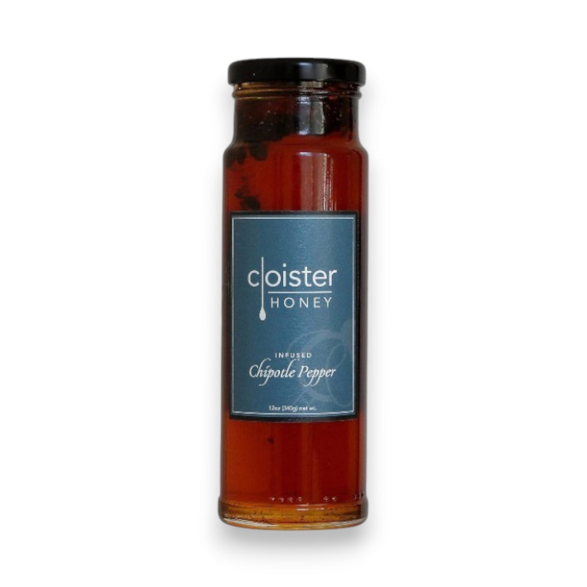A 12oz clear glass jar filled with rich dark amber honey, infused with chipotle pepper bits. The jar comes with a black lid and features a minimalist gray label bearing the brand name "Cloister Honey" in white text. Below it reads "Infused Chipotle Pepper," and the visible pieces of chipotle pepper make it an ideal addition to your BBQ sauce.