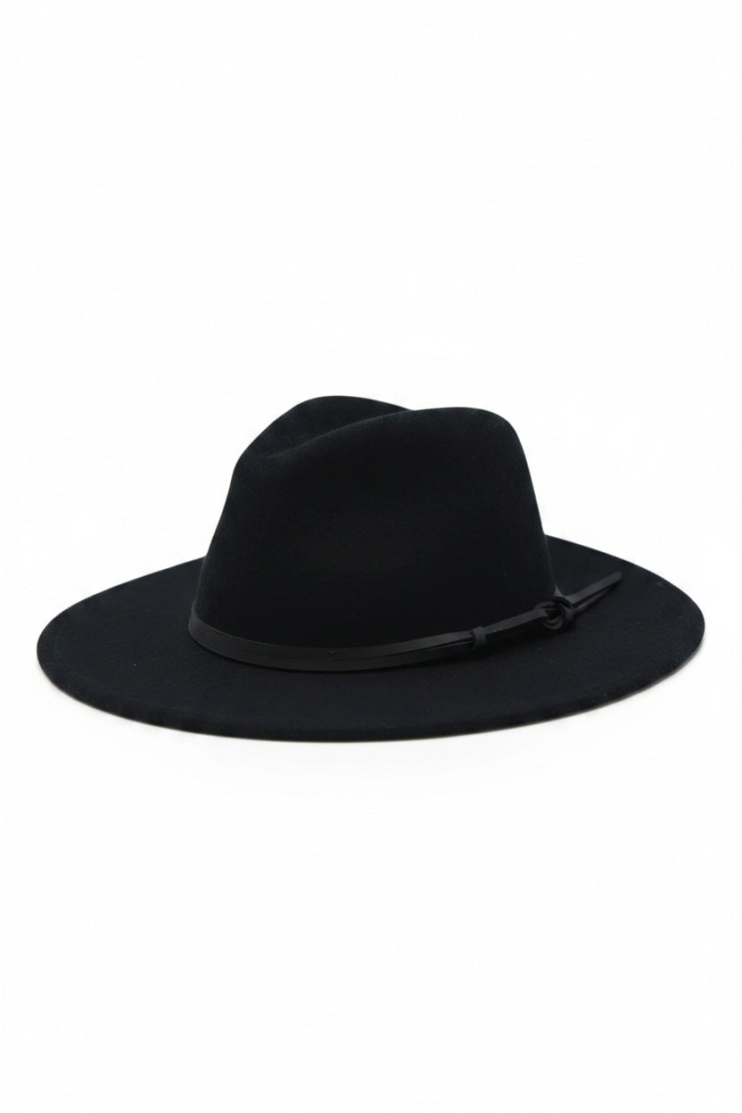 The BILLIE FEDORA HAT by WYETH is a tan wool felt fedora with a leather trim, showcasing a pinched crown and mid brim, beautifully displayed against a plain white background.