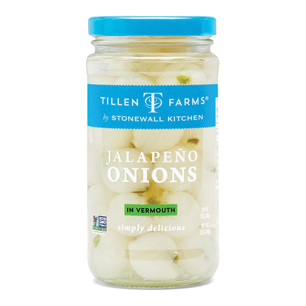 A jar of STONEWALL KITCHEN-TF Jalapeño Onions in Vermouth, perfect for vermouth-brined cocktail onion enthusiasts. The blue lid and label prominently display "simply delicious" and the Non-GMO Project Verified logo. These premium, hand-filled onions make ideal STONEWALL KITCHEN garnishes.