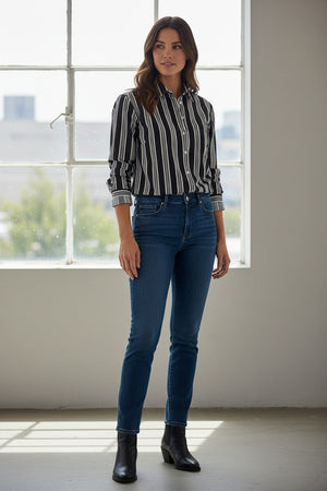 Fearrington Village model wearing a relaxed fit black and tan striped button-up shirt in brushed Italian cotton.