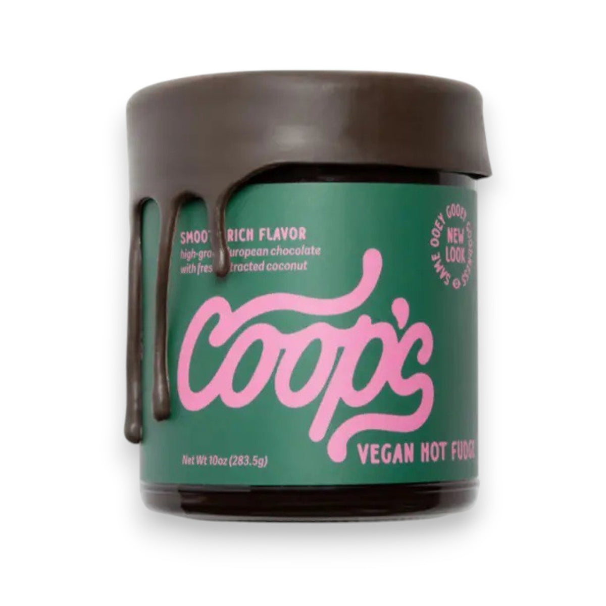 A jar of COOPS VEGAN HOT FUDGE features rich European chocolate fudge dripping down the side. The green label with pink lettering and a brown lid display the product name and description—ideal as an ice cream topping.