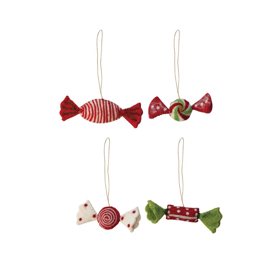 The CREATIVE COOP FELT CANDY ORNAMENT set includes four handmade wool felt ornaments in assorted red, white, and green candy shapes with hanging strings—perfect for adding festive charm to any holiday décor.