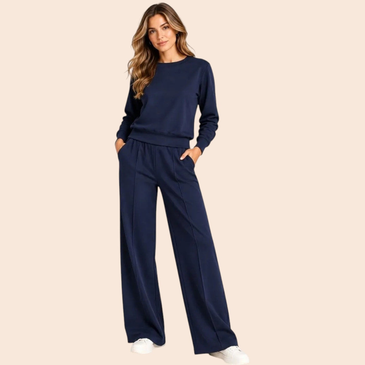 A woman wears a SOFTIES - DREAMTECH BOAT NECK WITH PINTUCK PANT SET in olive green, featuring a long-sleeve boat neck top and matching wide-leg pintuck pants.