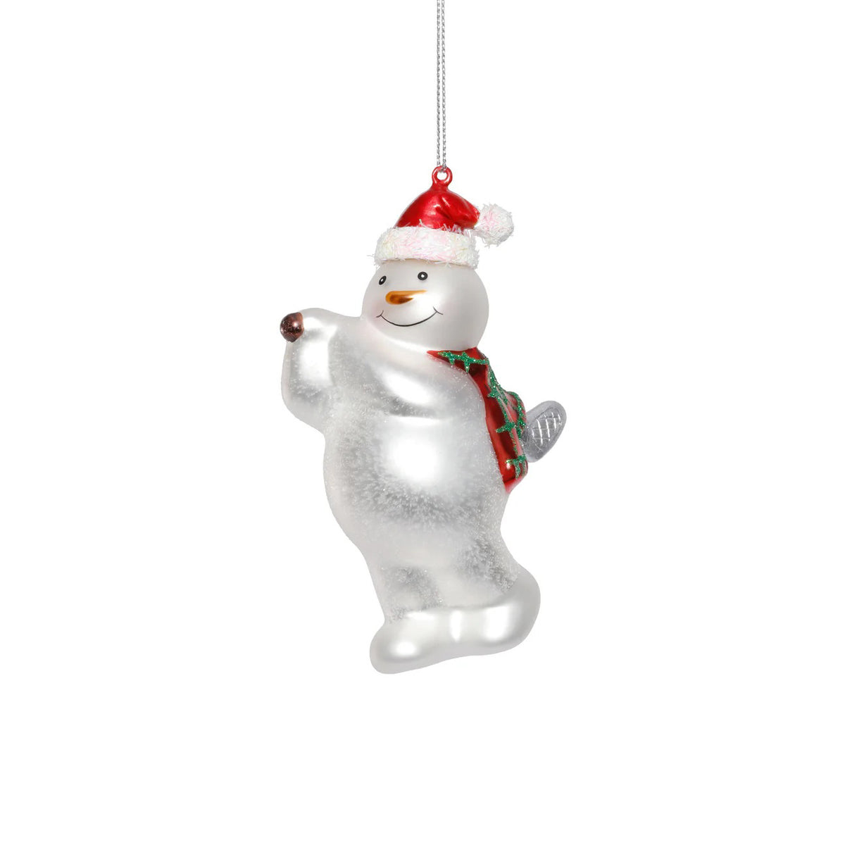 The ZODAX GLASS SNOWMAN PLAYING GOLF ornament, 3.5&quot;x5.25&quot;, hangs by a silver string and features a smiling snowman in a red Santa hat and green scarf, holding one arm up as he plays golf.