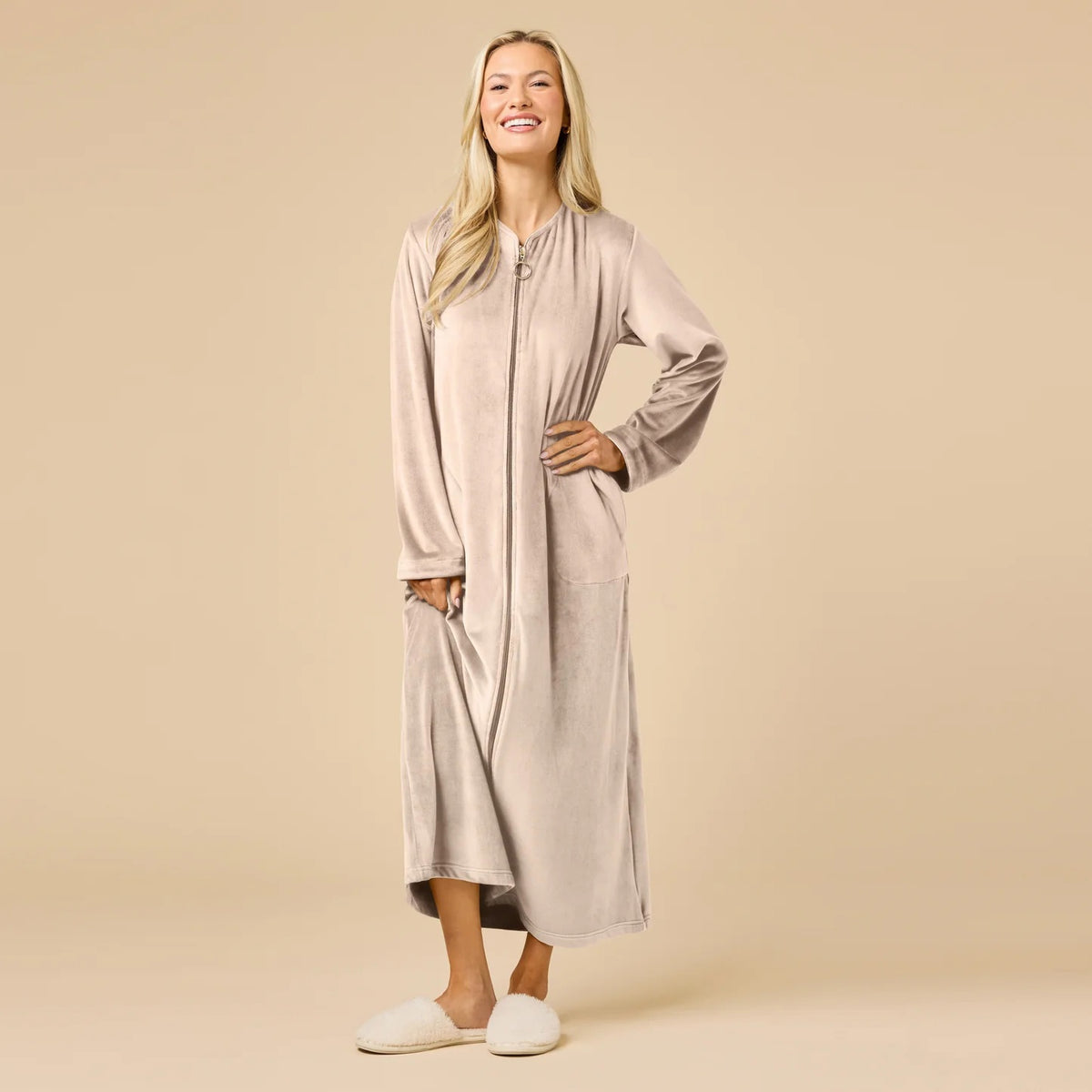 A long-sleeved, beige SOFTIES - SERENITY SHEAR MINK ZIP ROBE featuring a full-length zipper, round neckline, and two side pockets.