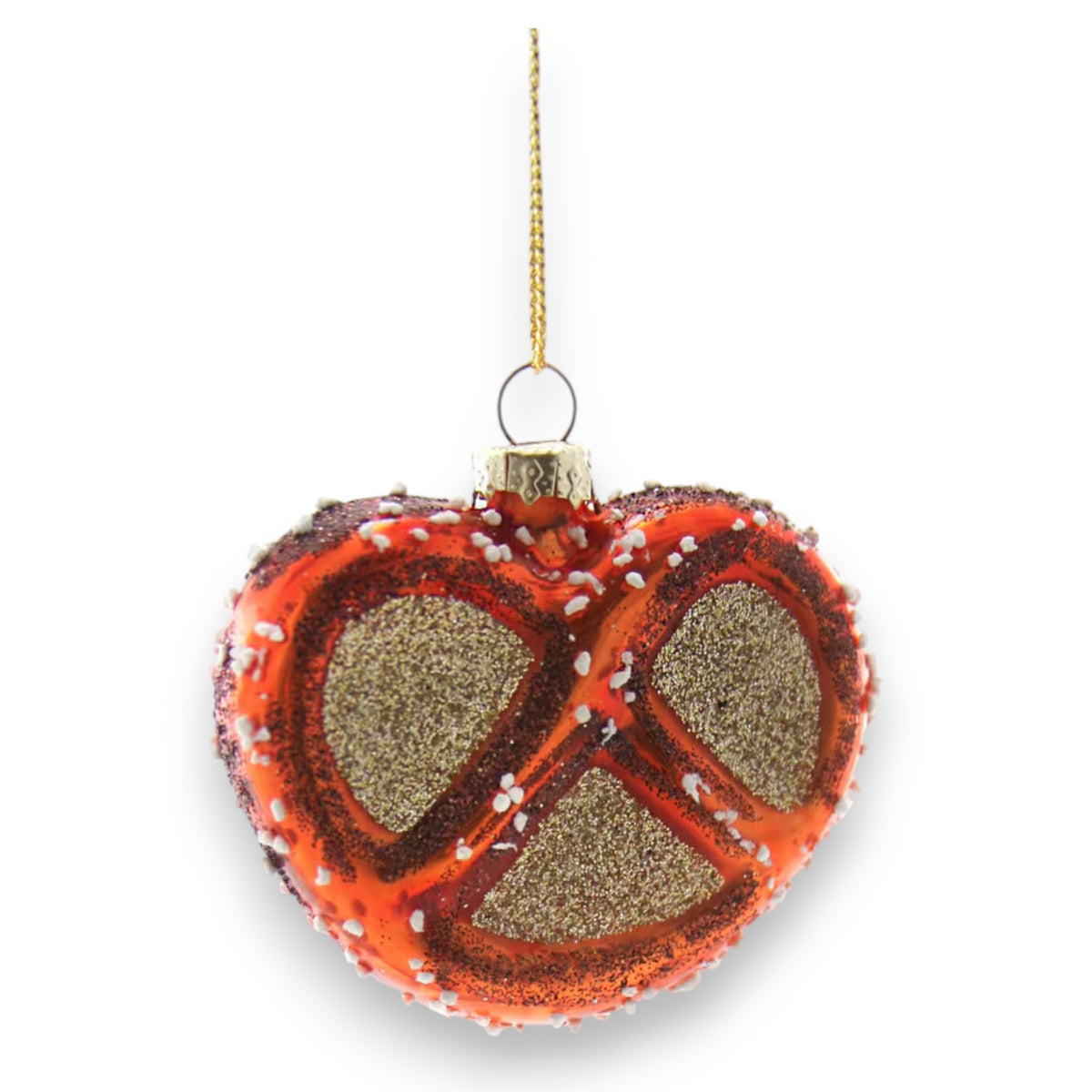 The CODY FOSTER GLITTERY PRETZEL ORNAMENT features red glaze, white sprinkles, and gold glitter, hanging from a gold string—a delightful piece for collectors and design lovers alike.