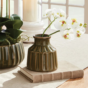 The NAPA HOME AND GARDEN - PHALAENOPSIS ORCHID STEM BUNDLE 6 features a bouquet of white orchids with pale pink centers and closed buds, tied with light brown twine. The realistic stems add elegance to home decor, beautifully arranged against a plain white background.