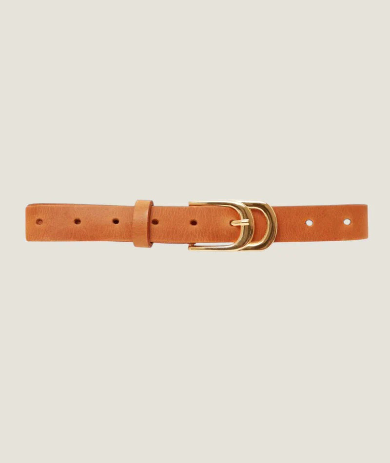 The INFINITY BELT by ADA is crafted from genuine Argentinian leather and features a gold double ring buckle, elegantly displayed against a crisp white background.