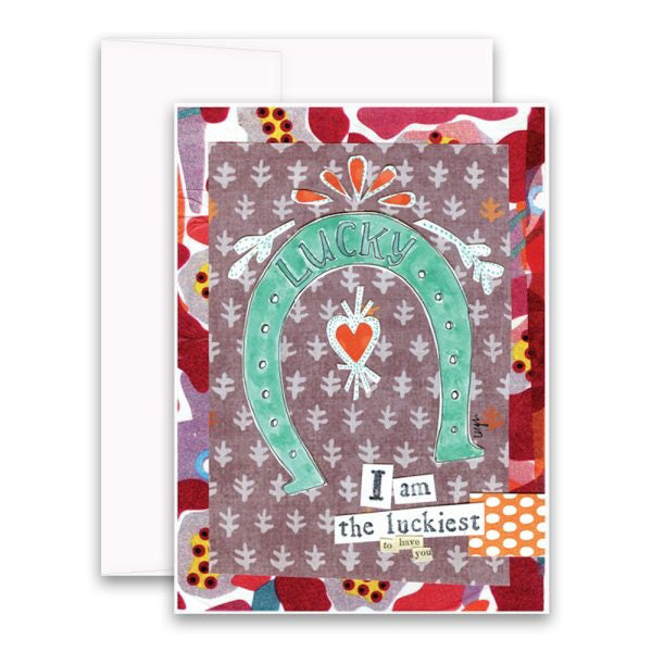The CURLY GIRL DESIGNS - LUCKIEST GREETING CARD by CURLEY GIRL DESIGN, INC features a colorful abstract background with a central design of a turquoise horseshoe and the word "Lucky" at the top. Below it, the text reads "I am the luckiest to have you," accompanied by a small red heart illustration. The collage art style is reminiscent of Curly Girl designs.