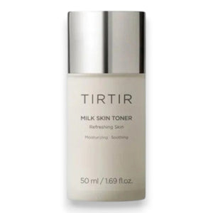 A hand holds a white bottle of TIRTIR - MILK SKIN TONER MINI, 50ML by KOSMIC KBEAUTY SKINCARE—a hydrating toner crafted to help you achieve glass skin. Key benefits are displayed with golden icons: soothing, gentle care, deep moisturization, anti-aging, and brightening. Featured ingredients like niacinamide are highlighted beside the icons. At the bottom, milk splashes accentuate the design.