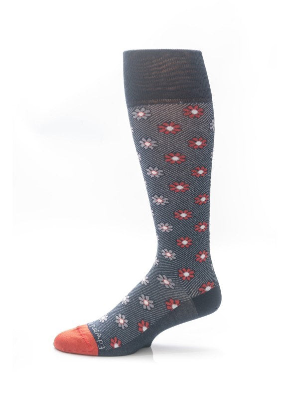 EDWARD ARMAH - NAVY RED FLORAL SOCKS: A single navy knee-high sock featuring a red and white floral pattern with solid orange toe and heel, displayed on a white background.