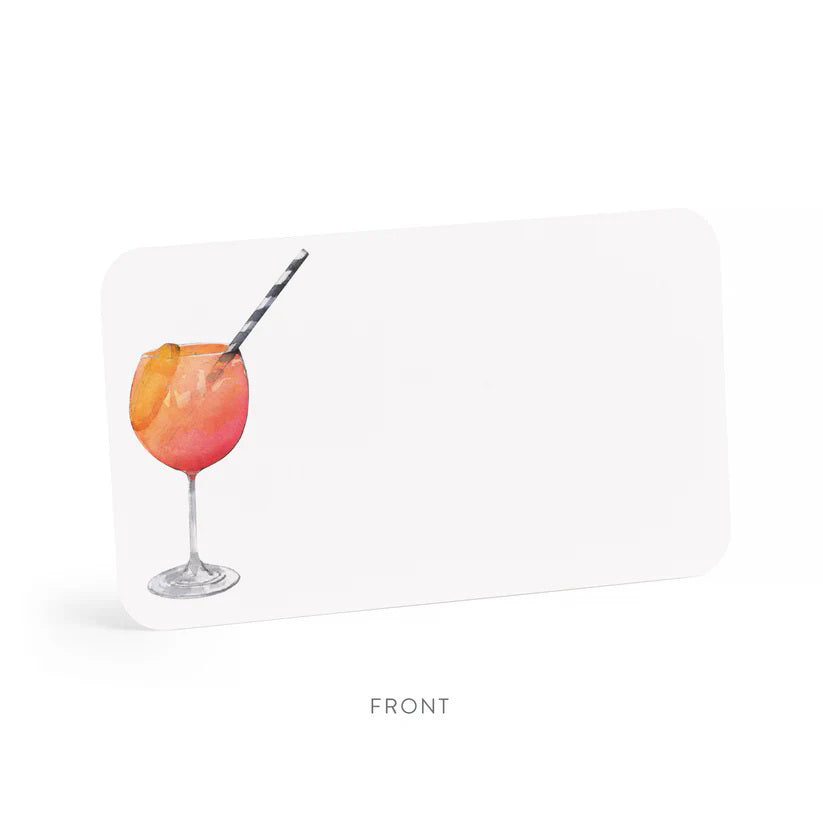 A clear box contains "E. FRANCES PAPER - APEROL SPRITZ LITTLE NOTES" featuring tiny notecards. The front card displays a watercolor of a cocktail with a striped straw and the phrase "use unsparingly.